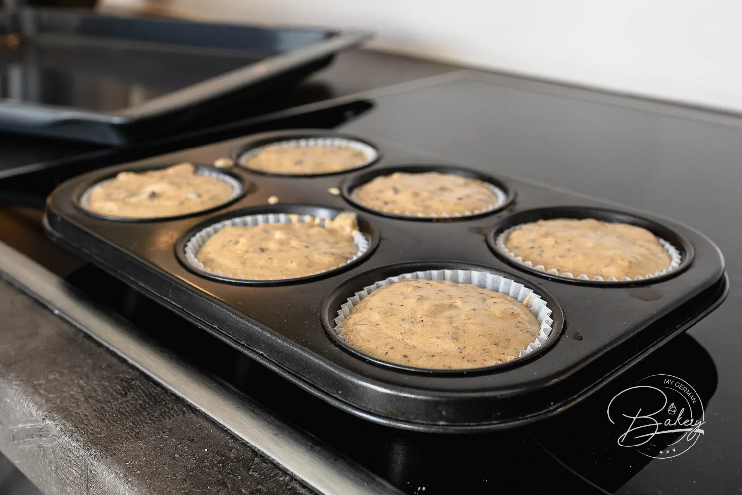 Muffin baking form pan - Espresso muffins recipe - coffee muffins baking instructions - muffins with chocolate, nuts, fruits - quick made muffins - easy baking recipe for kids and adults - Mini cake recipe for delicious coffee muffins. Muffins and cupcakes with coffee flavor, dark chocolate, nuts.