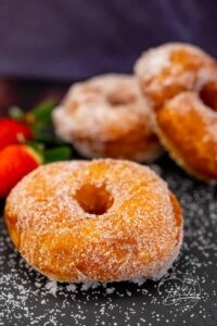 Donuts recipe - delicious, fluffy, easy and quick homemade - Make your own donuts - simple donuts recipe and Berlin variant with yeast dough baked in a pan. Delicious donuts cake rings with sugar, powdered sugar, chocolate.