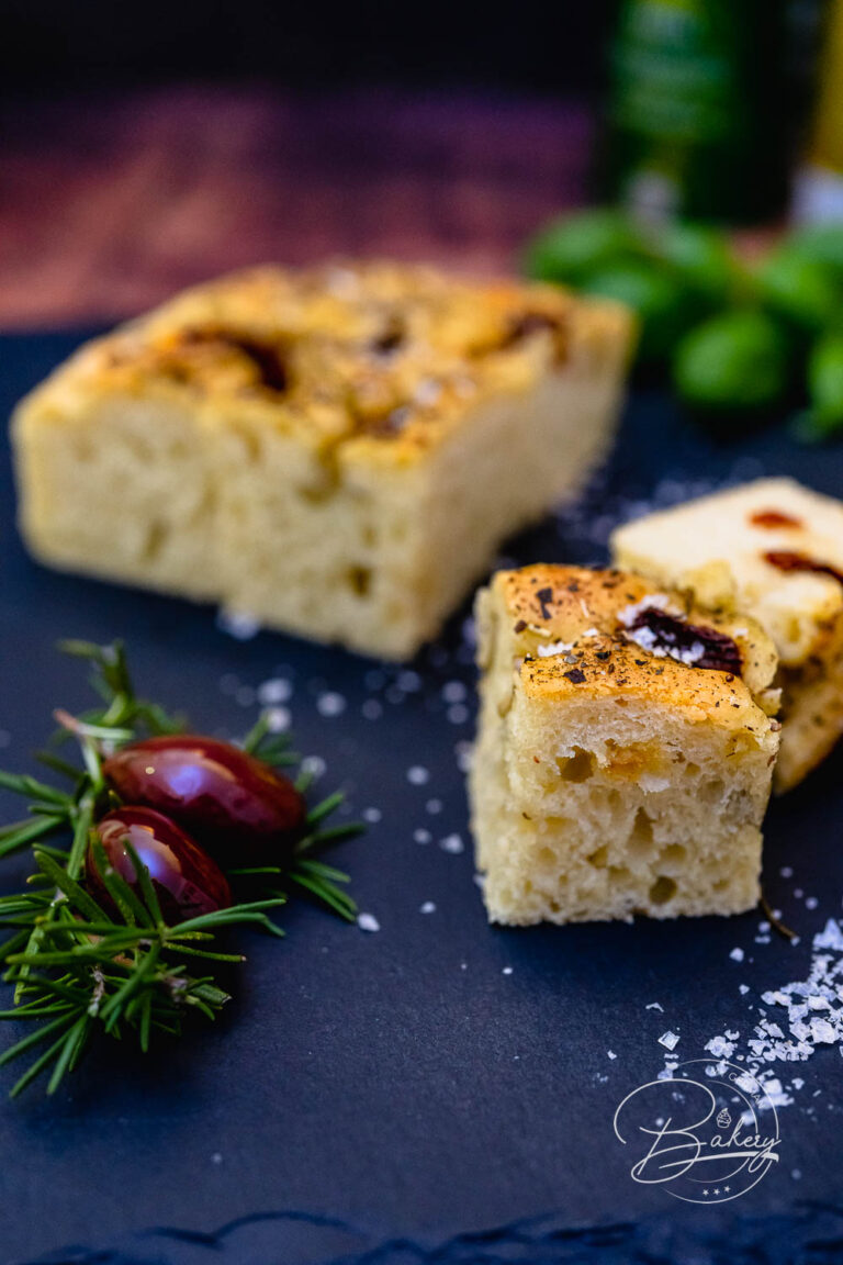 Focaccia recipe - delicious, simple bread with olives and tomatoes - Italian Bread Focaccia Schiacciata Recipe - Dinner Bread for Italian Evening Baking Recipe - Simple Focaccia recipe for airy, fluffy, delicious bread made with yeast dough, olives, tomatoes, rosemary, Italian herbs.