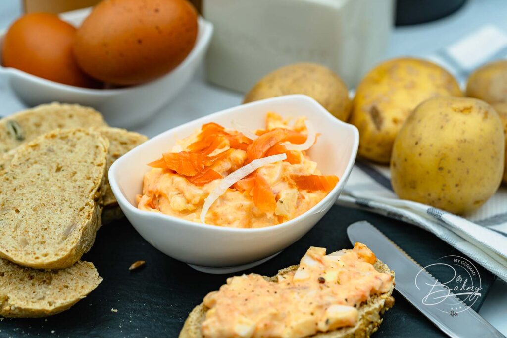 Salmon salad recipe - salmon spread and side dish for boiled jacket potatoes and potatoes or as bread spread. Mixture of eggs, salmon or salmon slices or pollock puree, onions and mayonnaise