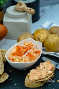 Salmon salad recipe - salmon spread and side dish for boiled jacket potatoes and potatoes or as bread spread. Mixture of eggs, salmon or salmon slices or pollock puree, onions and mayonnaise